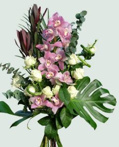 10 roses and a stem of orchid in a tall arrangement 